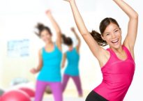 Fitness dance zumba class aerobics. Women dancing happy energetic in gym fitness class.