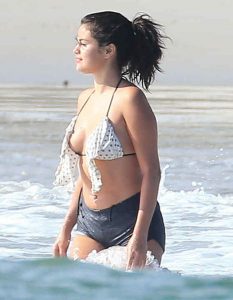 **USA ONLY** *EXCLUSIVE* **MUST CALL FOR PRICING** Puerto Vallarta, Mexico - Singer/Actress Selena Gomez and her friends hit the beach while on vacation in Mexico on April 18, 2015. Selena who caught flack for being a little flabby in an Instagram post on Thursday, fought back against those haters saying she's happy with how she looks. Although she wore her shorts into the water instead of showing off her complete bikini body. **MANDATORY CREDIT MUST READ: FameFlynet/AKM-GSI** AKM-GSI          April 20 2015 To License These Photos, Please Contact : Steve Ginsburg (310) 505-8447 (323) 423-9397 steve@akmgsi.com sales@akmgsi.com or Maria Buda (917) 242-1505 mbuda@akmgsi.com ginsburgspalyinc@gmail.com